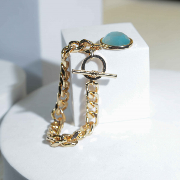 Yellow Gold Bracelet Adorned with a Round Blue Stone Like a Gemstone